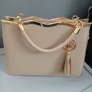 Elegant Cream Handbag with Gold Accents